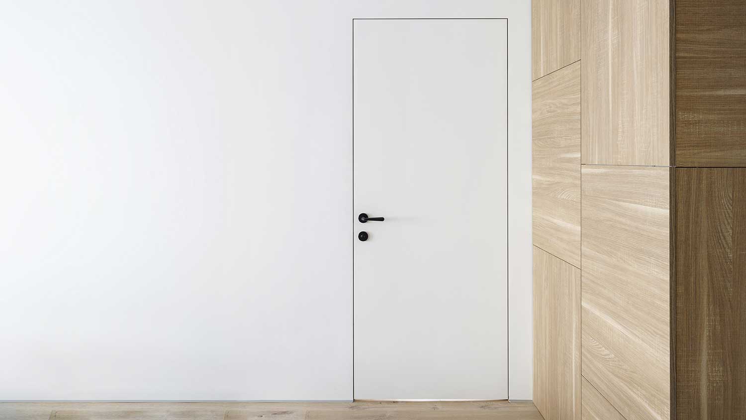 Minimalist style flush door installed in contemporary apartment