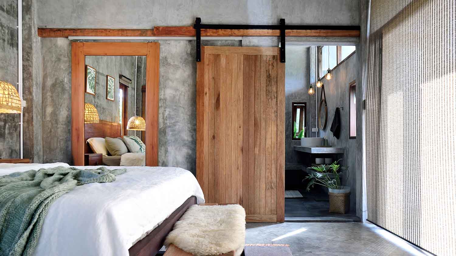 Wooden barn doors in a modern bedroom