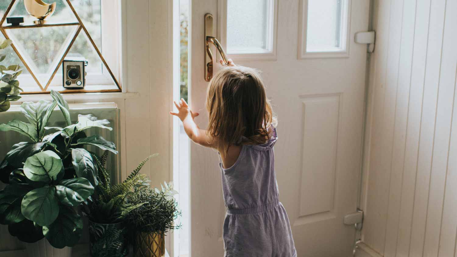 Girl opening a door