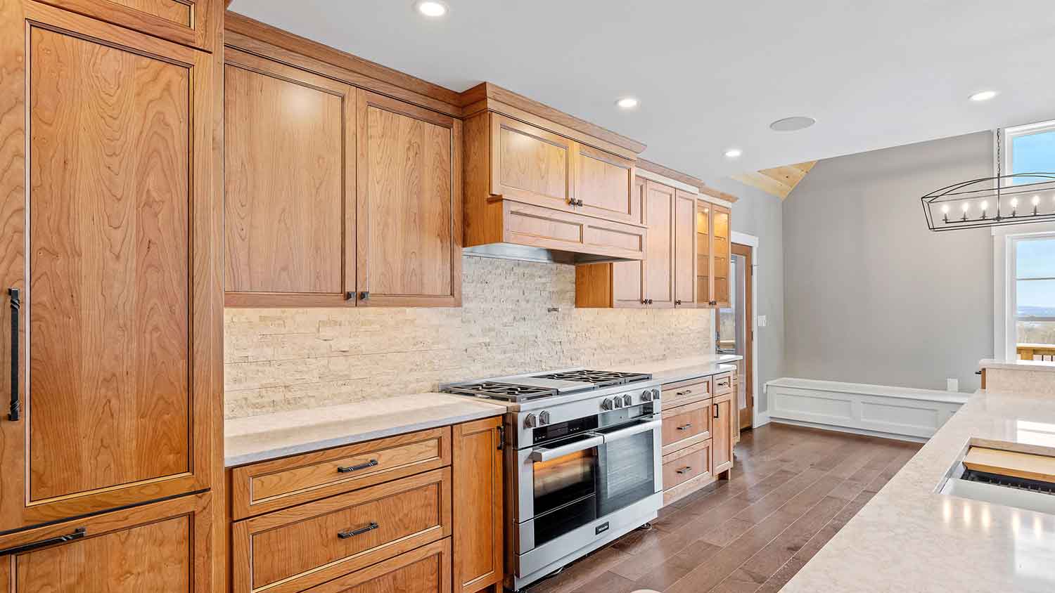 Large kitchen with amber wooden cabinets