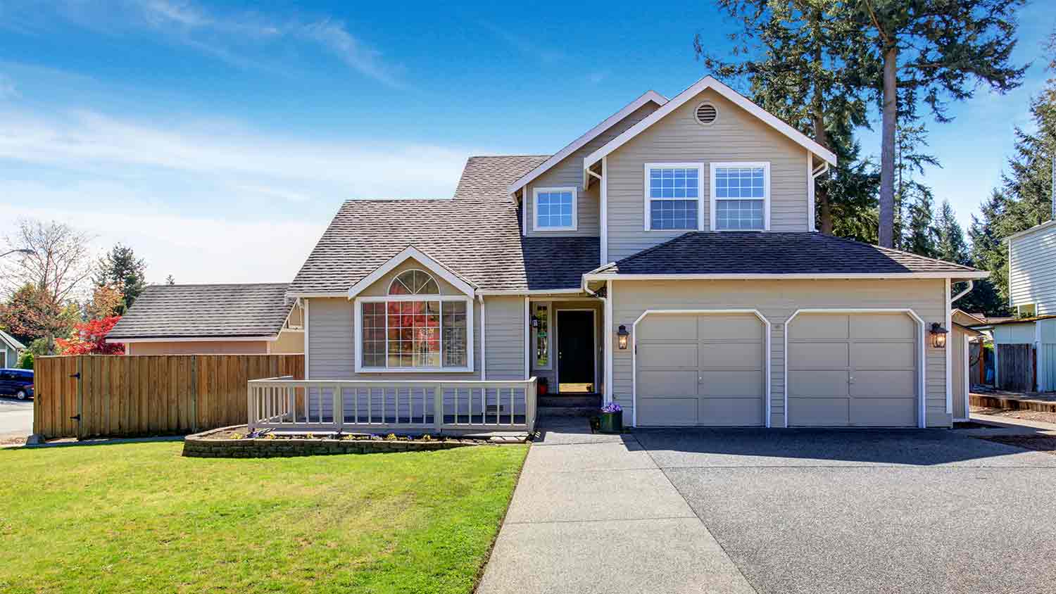 grey suburban home with porch