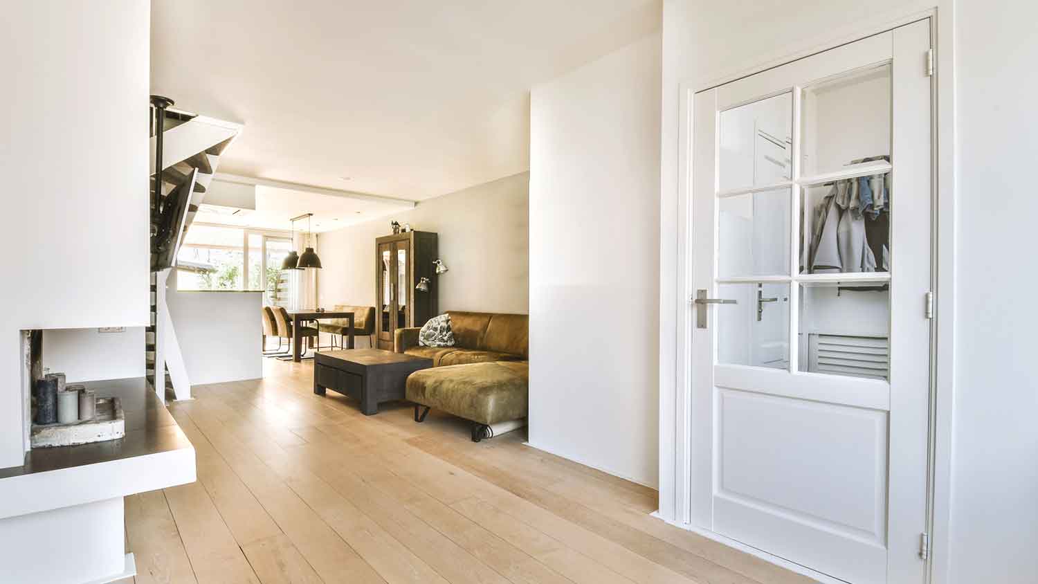 Mud room with white windowed door