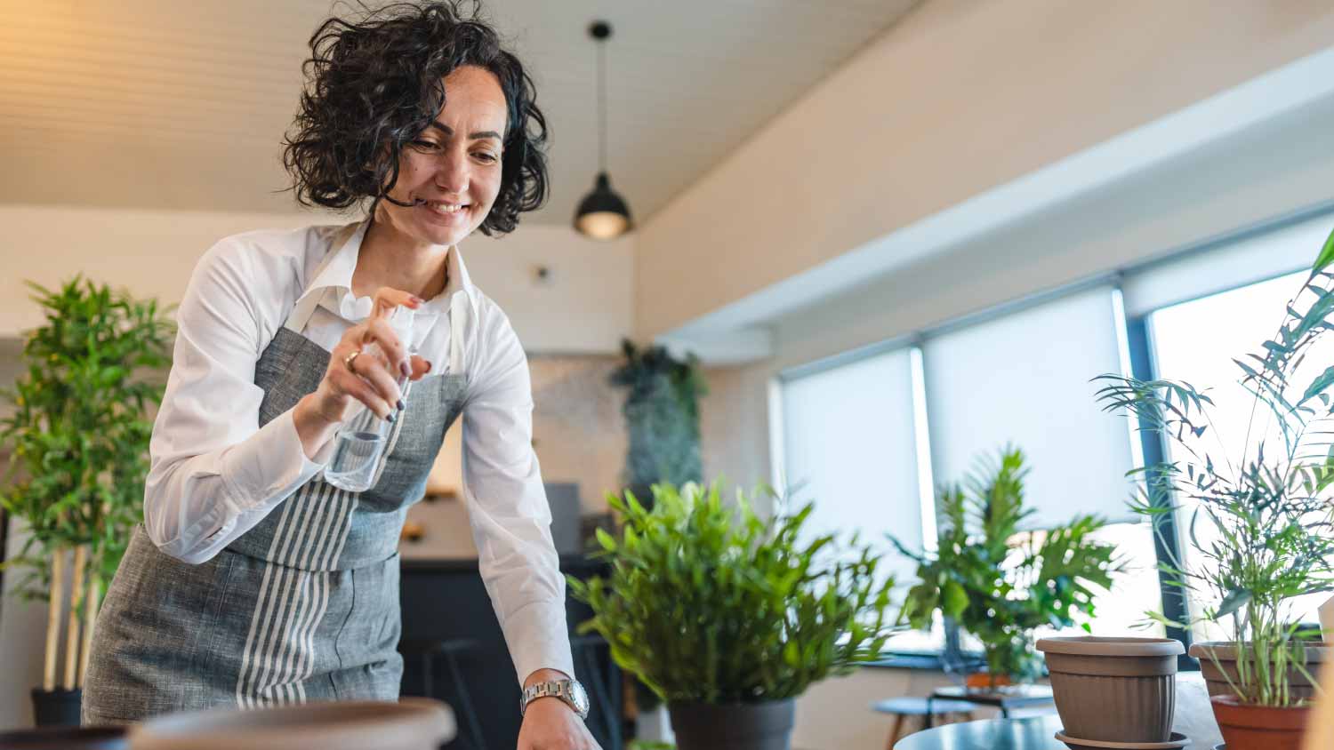Woman taking care of plants