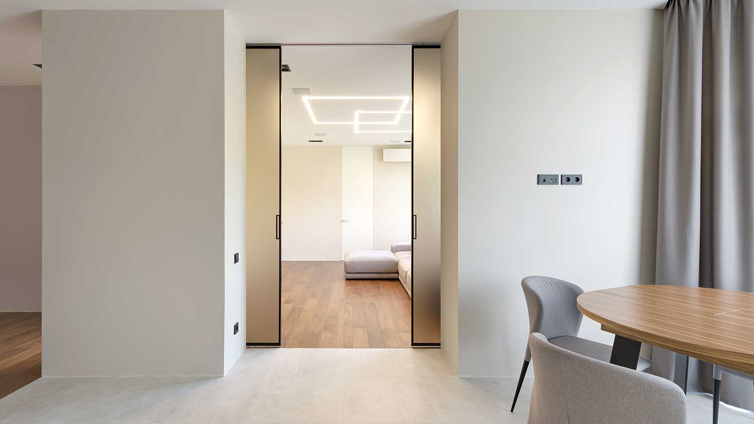Pocket doors separating bedroom and living room