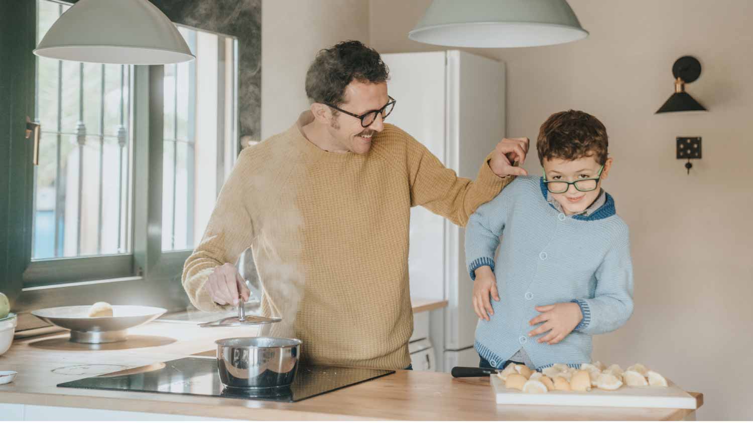 Father cooking with his son