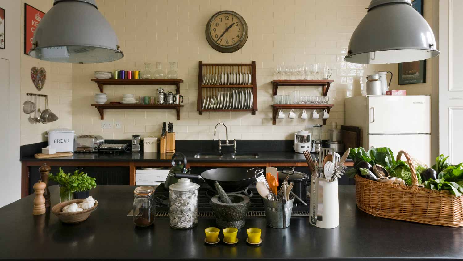 A kitchen with black granite countertops