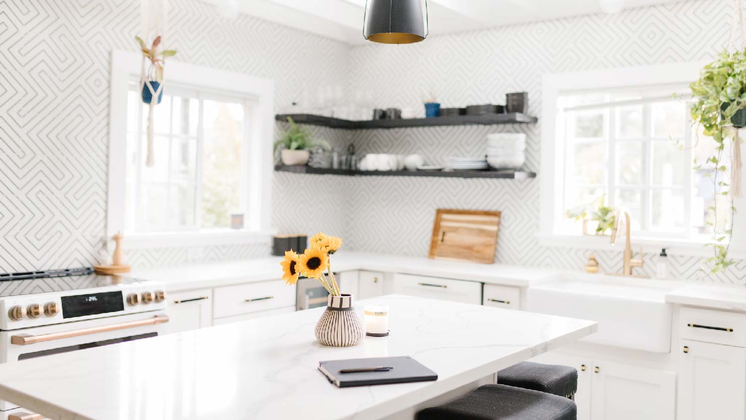 A kitchen with white granite countertops