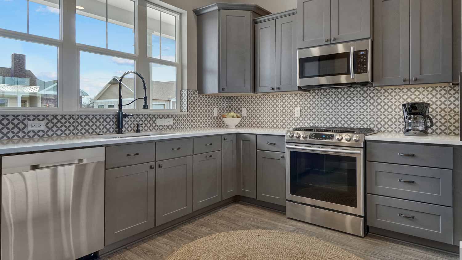 bright kitchen with dark gray cabinets