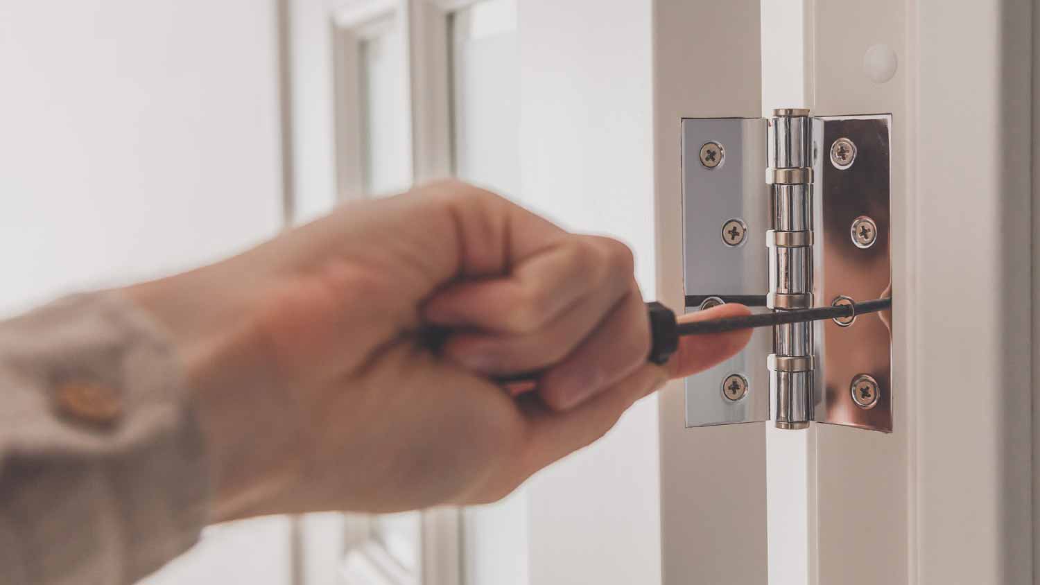Man removing door