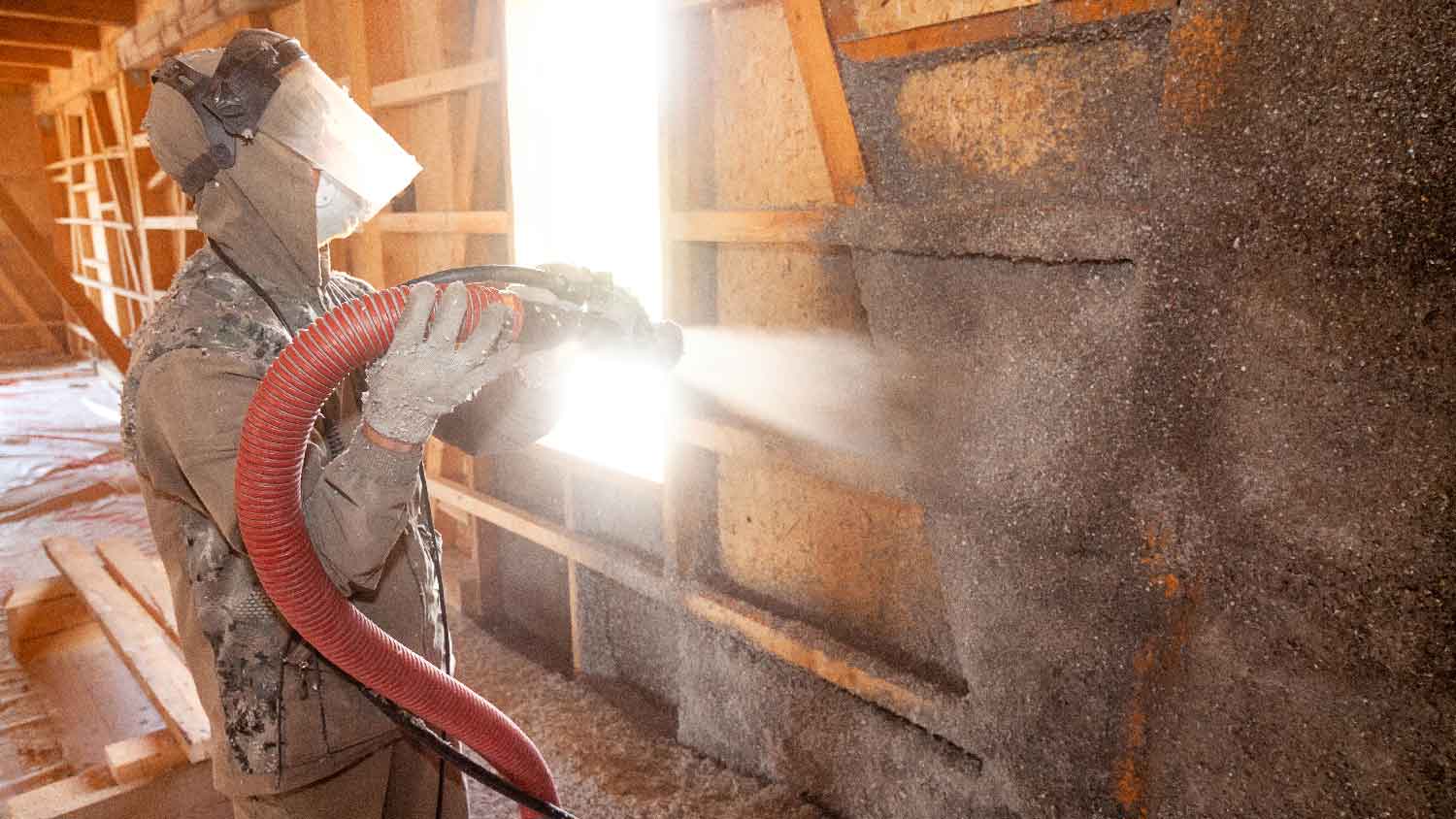 A professional installing cellulose insulation