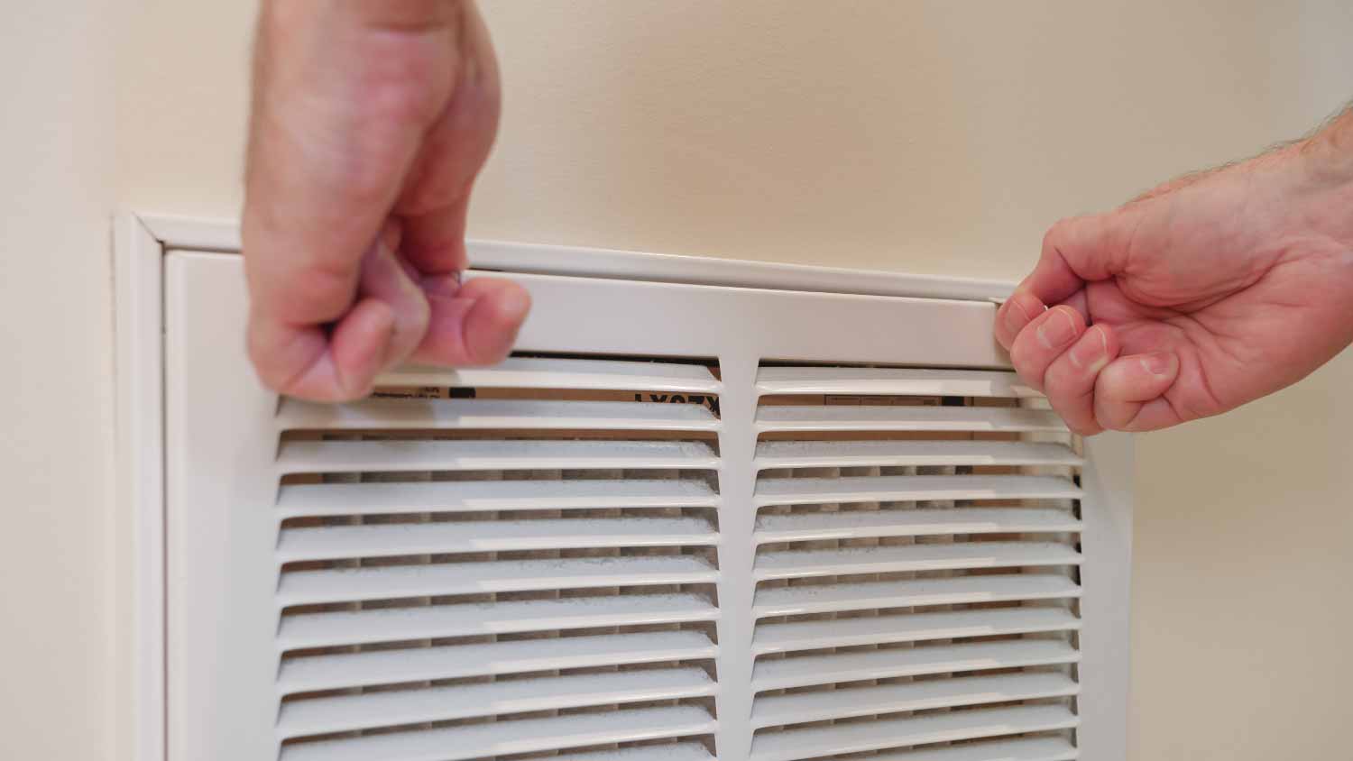 Man replacing home cooling system