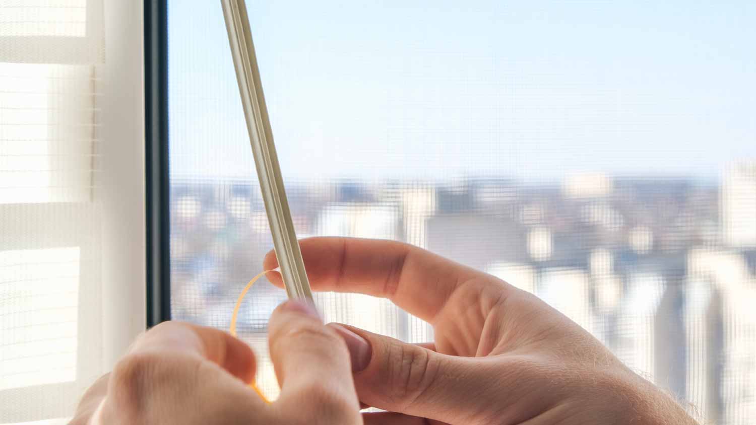 Man replacing weather stripping