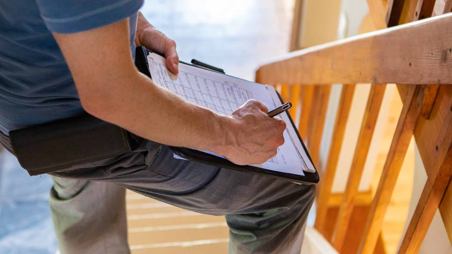 building inspector filling in a form