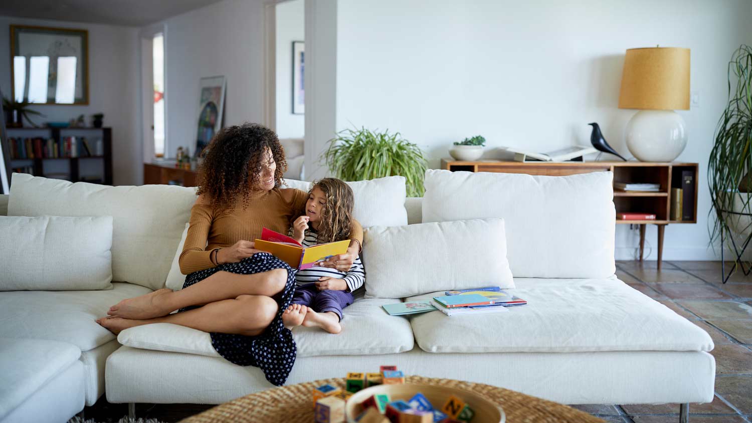 mother and daughter lounging at home