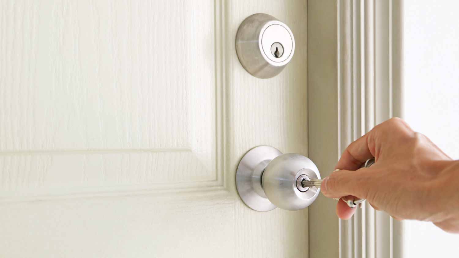 Man opening door with a key