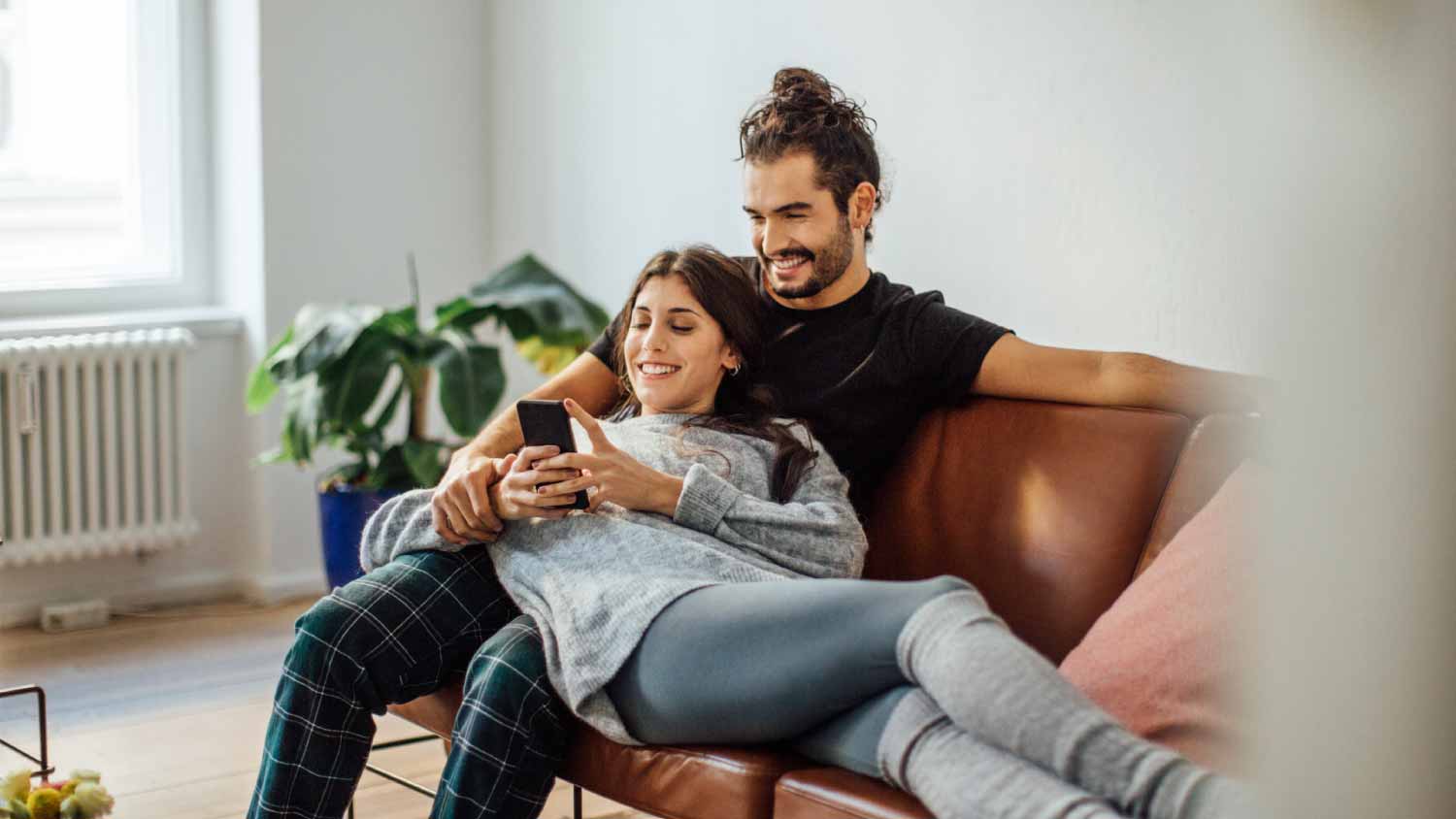 Young couple relaxing on sofa