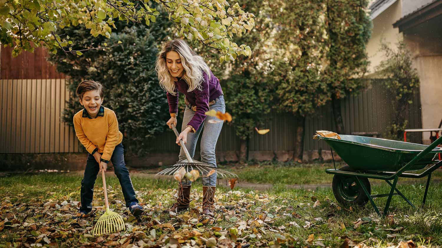Mother and son playing in backyard