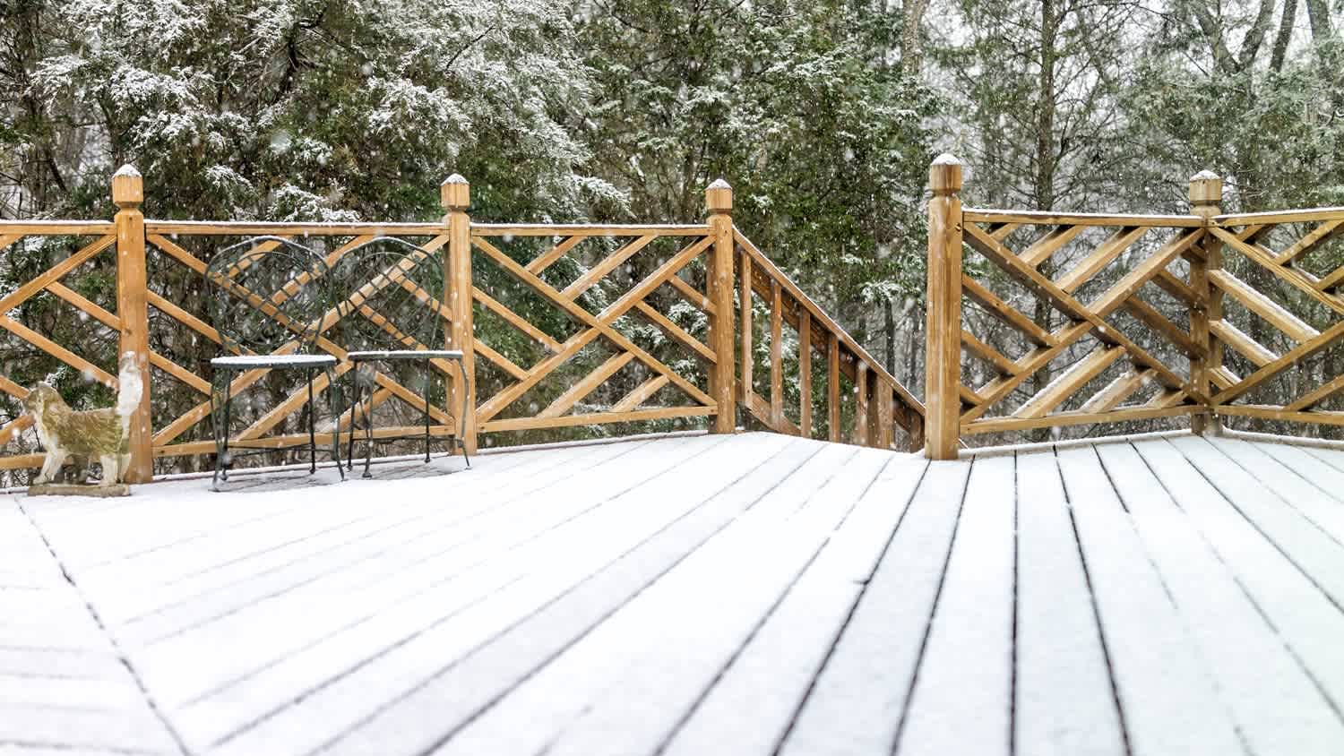 A wooden deck covered in snow