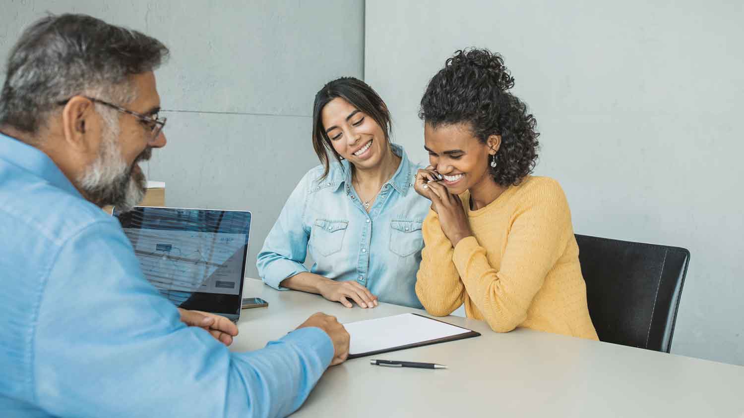 Real estate agent and clients closing the deal