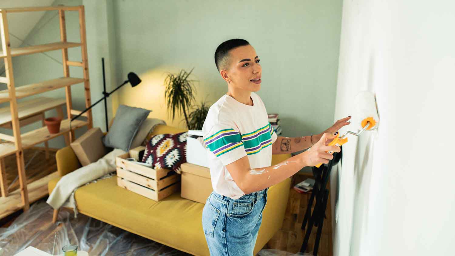 Using paint roller to repair living room wall
