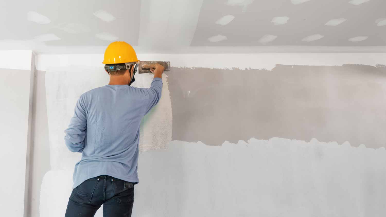 Man working with plaster