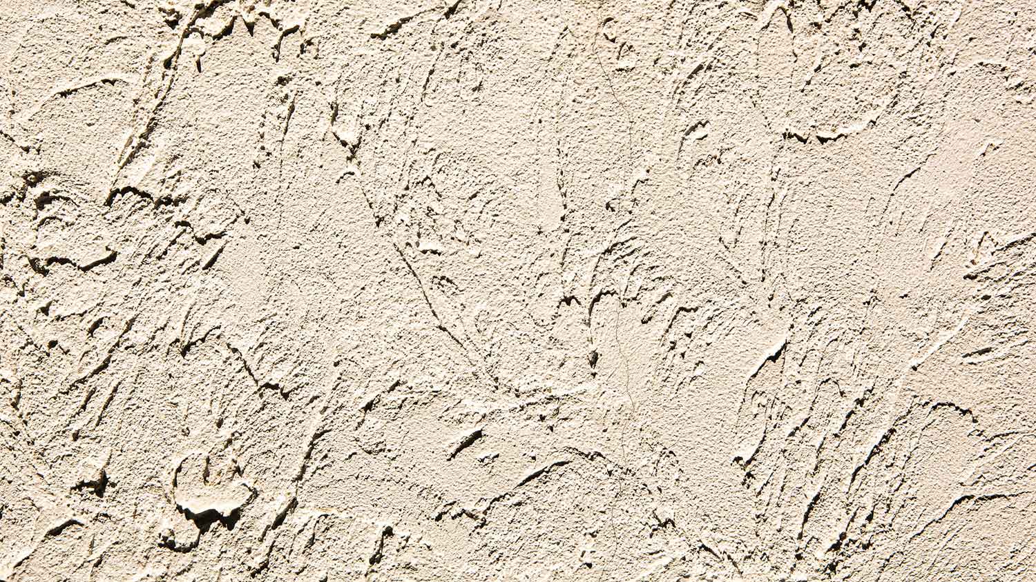 Wall with roughcast plaster finish