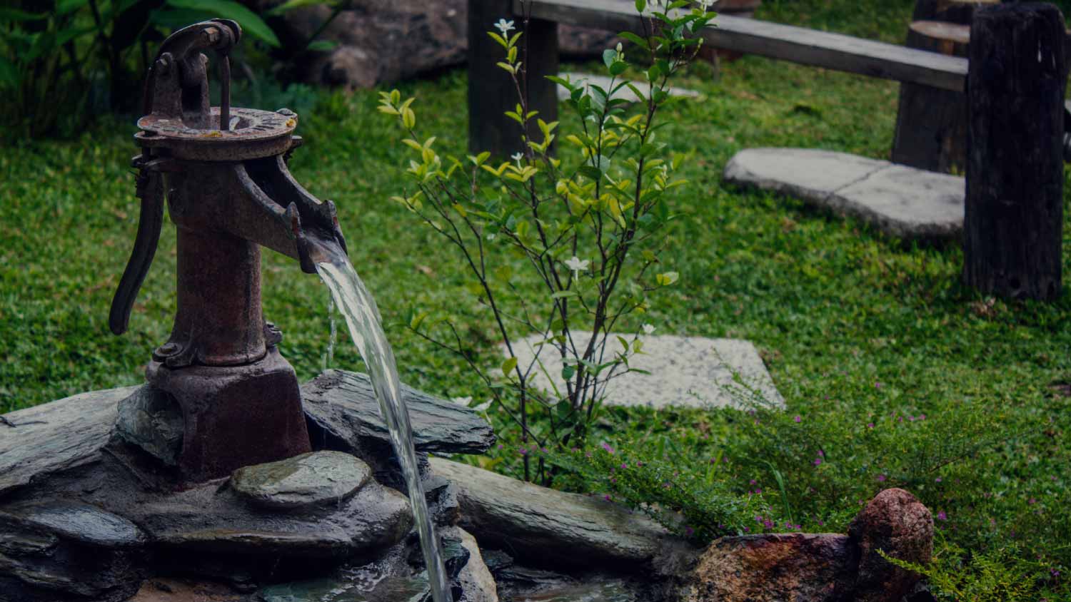 Pump fountain in a garden