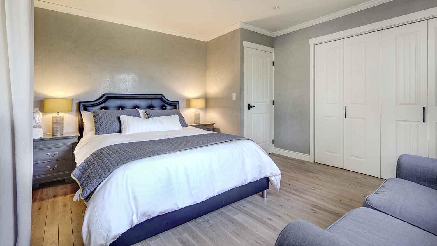 Bedroom interior with gray venetian plaster walls