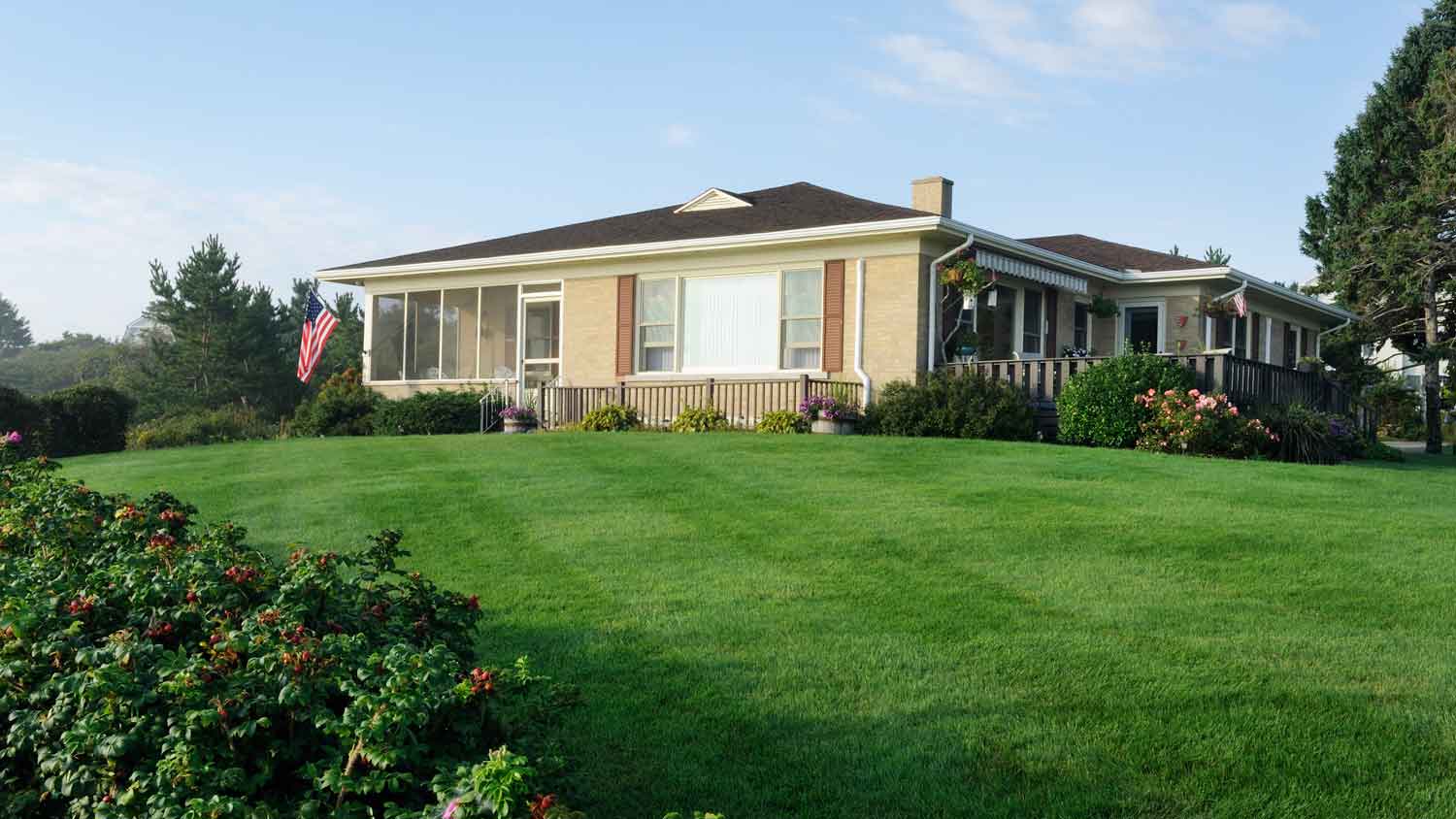 A bungalow with a large front yard