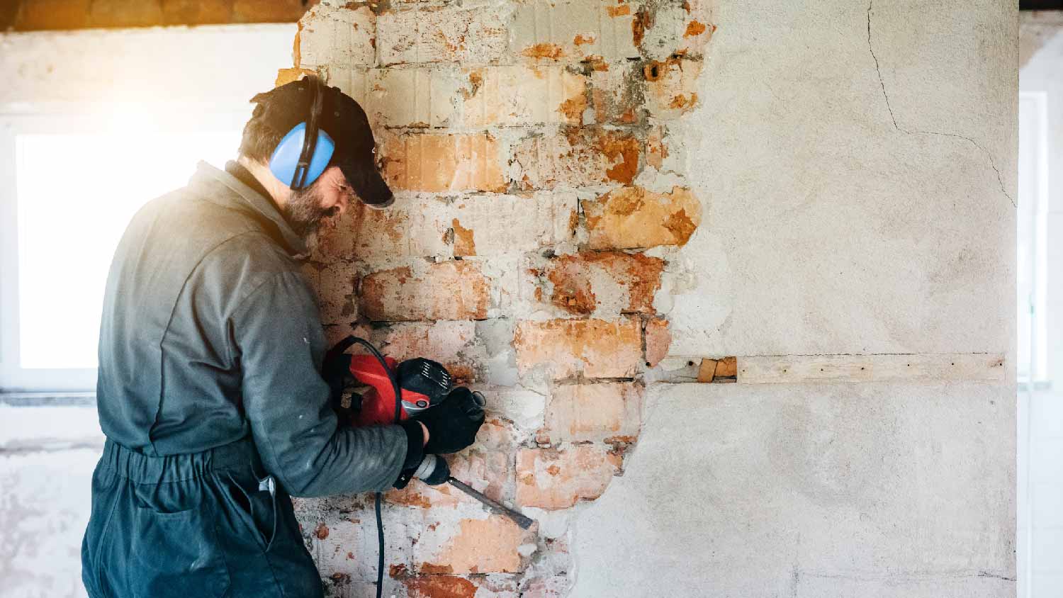 A man demolishing a wall