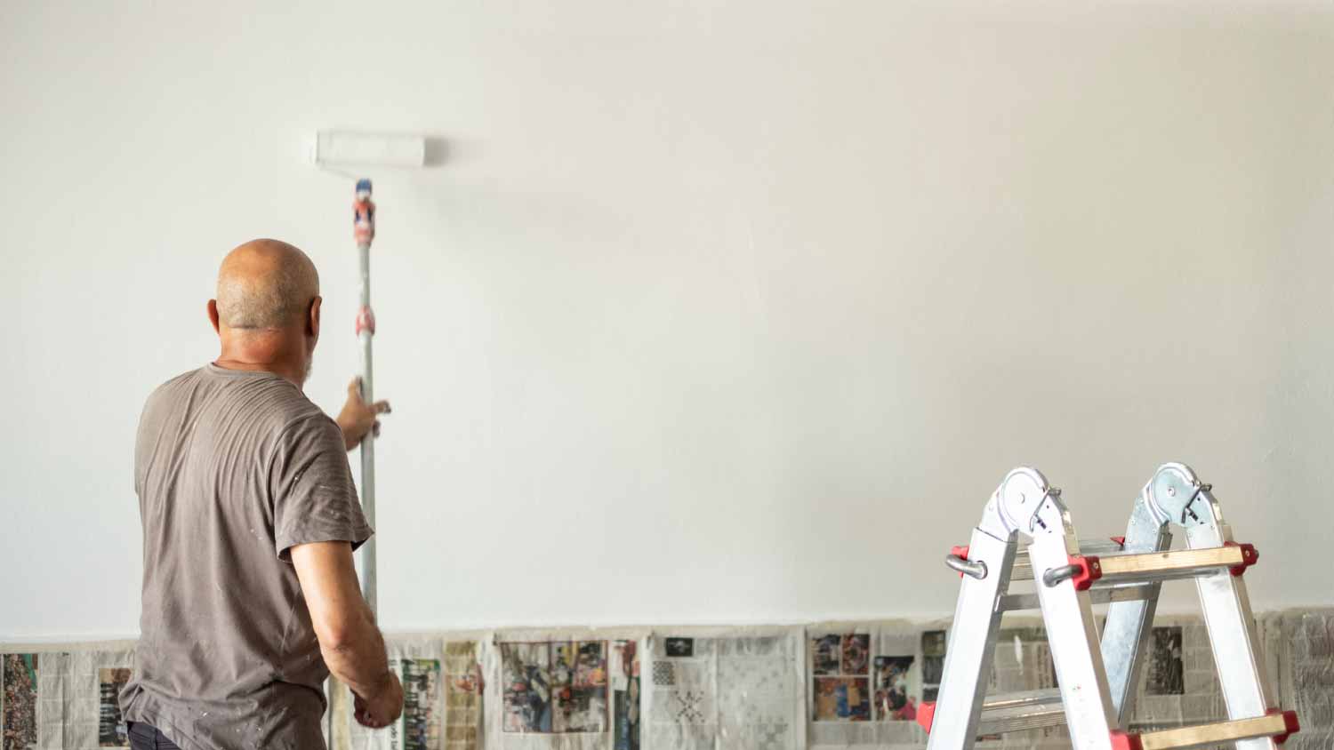 Man applying white paint