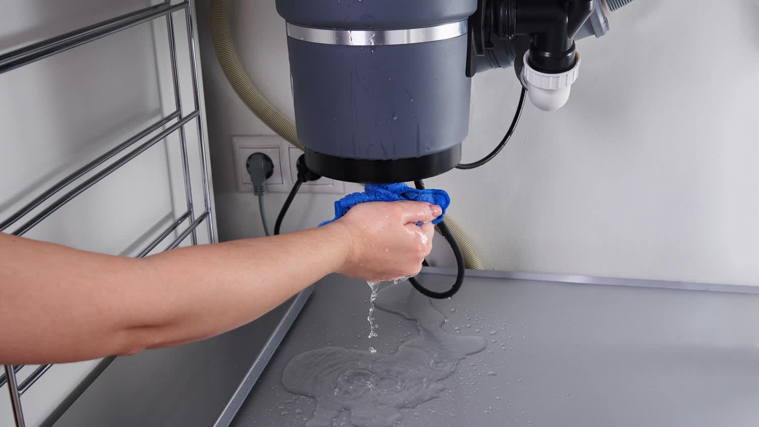 waste disposal leak under the sink