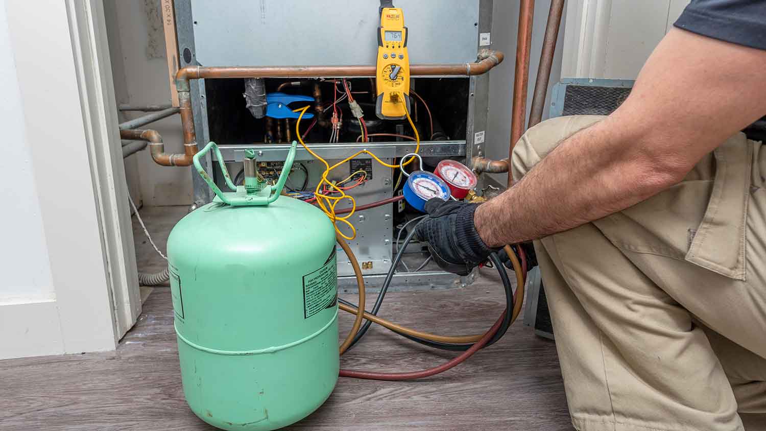 HVAC professional charging air conditioner refrigerant