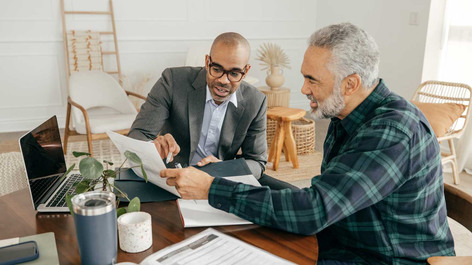 A homeowner talking to a financial advisor