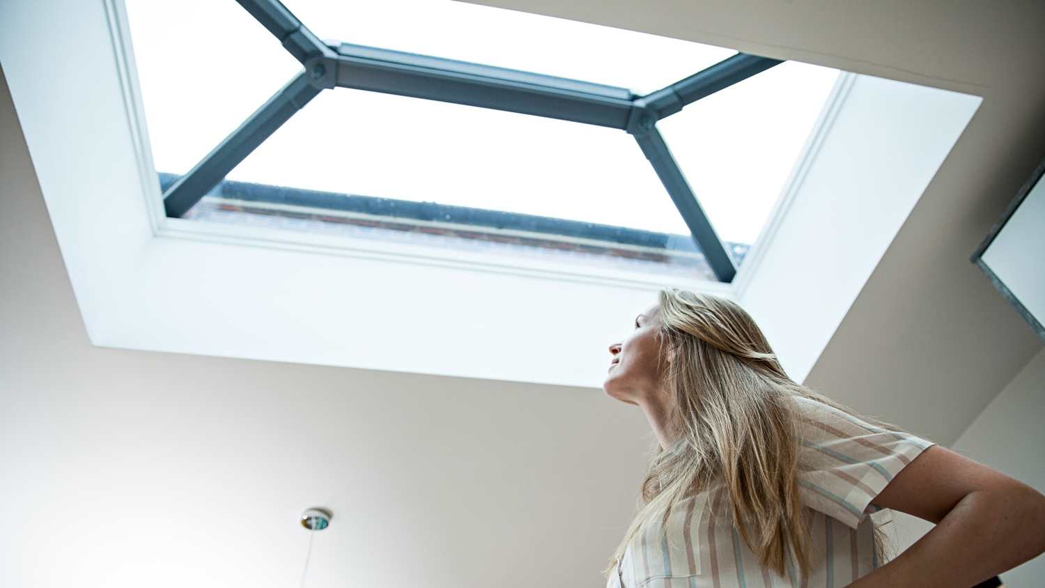 Woman looking at skylight