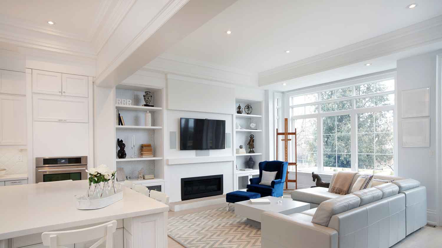 Bright living room with drywall ceiling