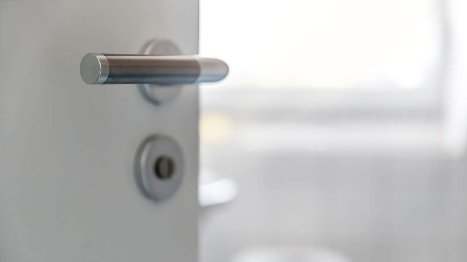 A hand lever of a bathroom door