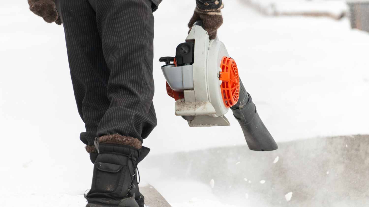 Man cleaning street from snow