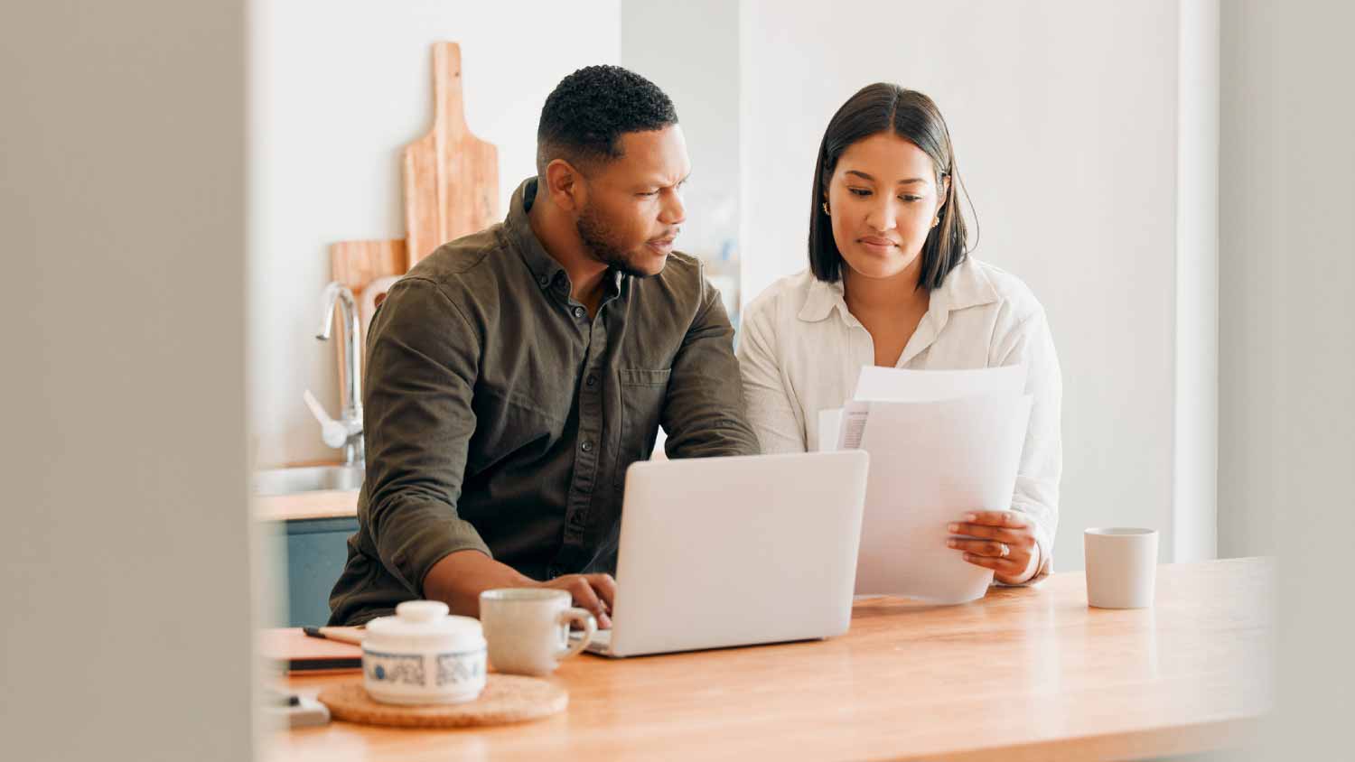 Couple with laptop looking at budget