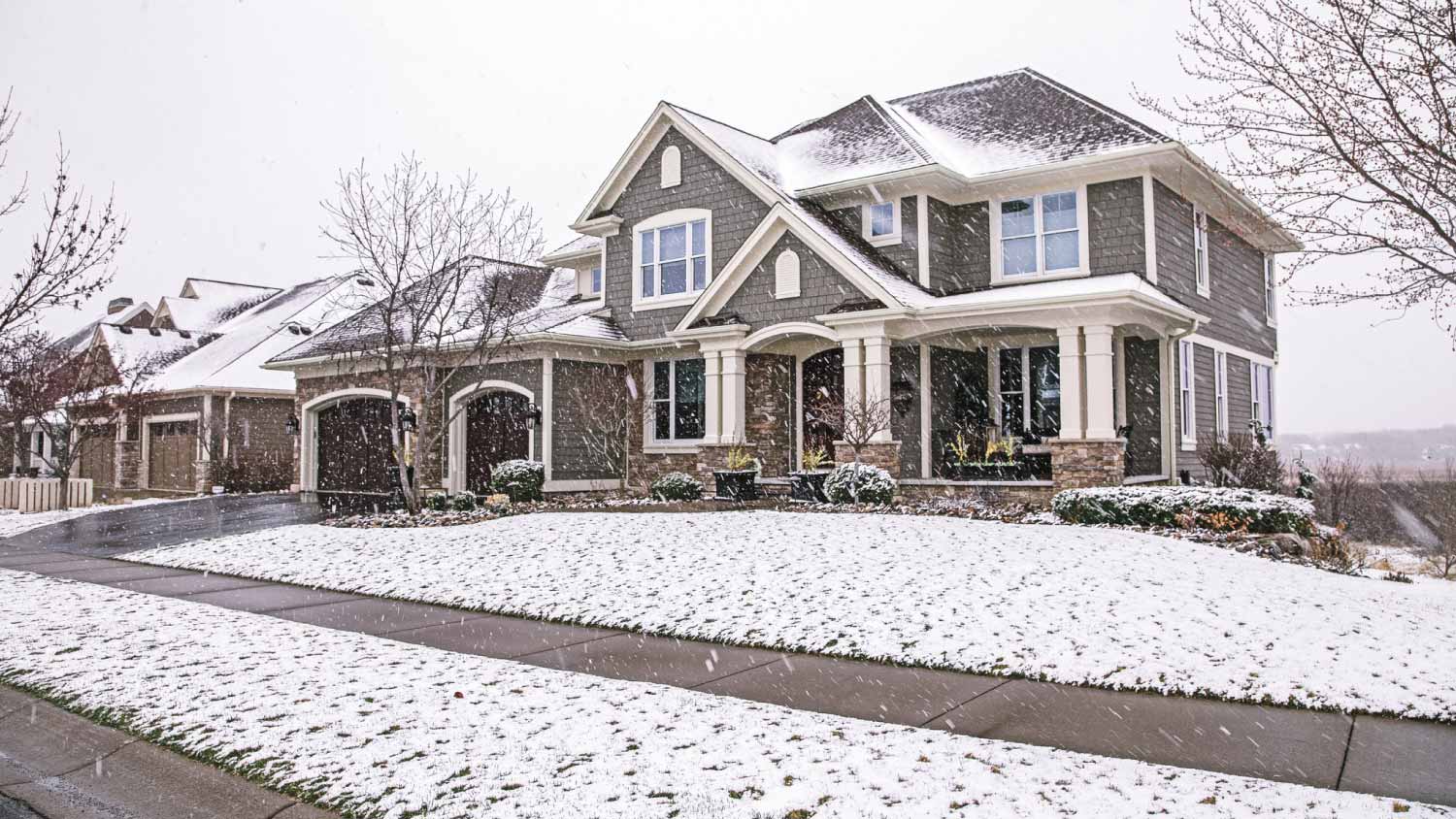 Suburban house snowing