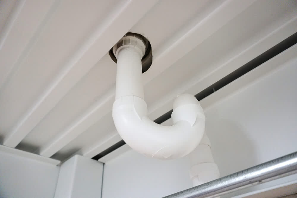 PVC pipe with a standard sewer trap