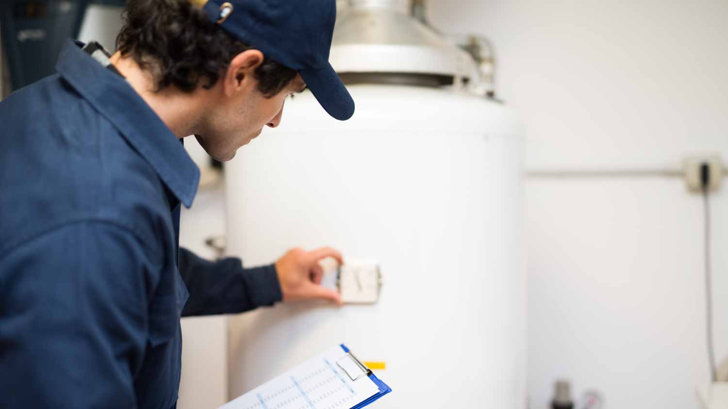 Plumber repairing an hot-water heater