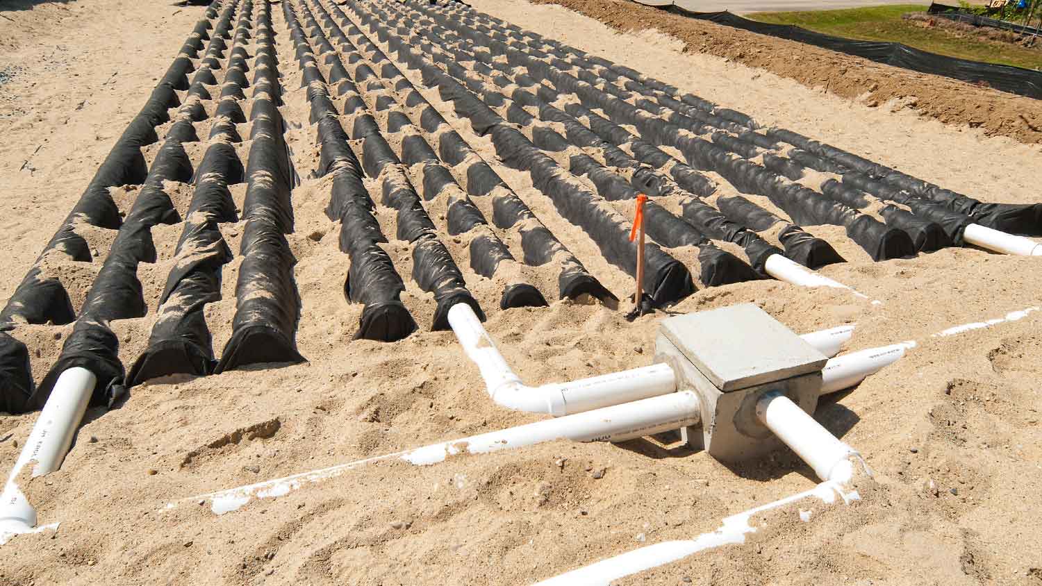 Concrete distribution box in a septic system leach field
