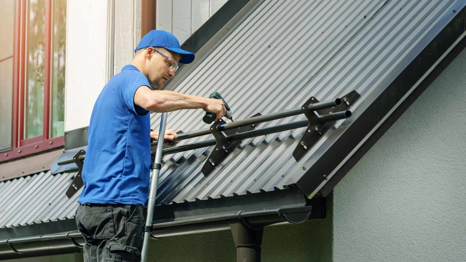 professional installing snow guards