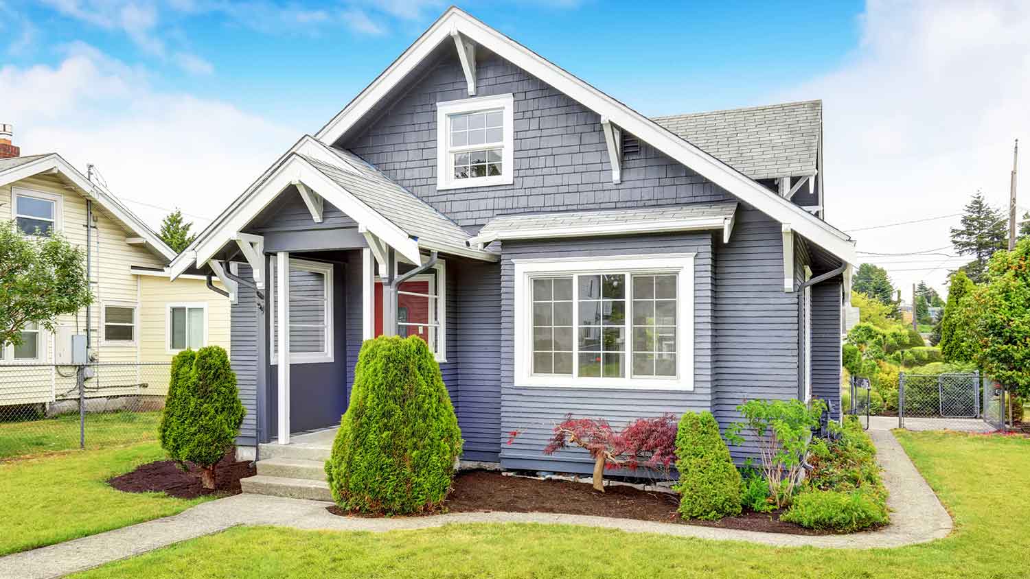 Small suburban house with gray siding