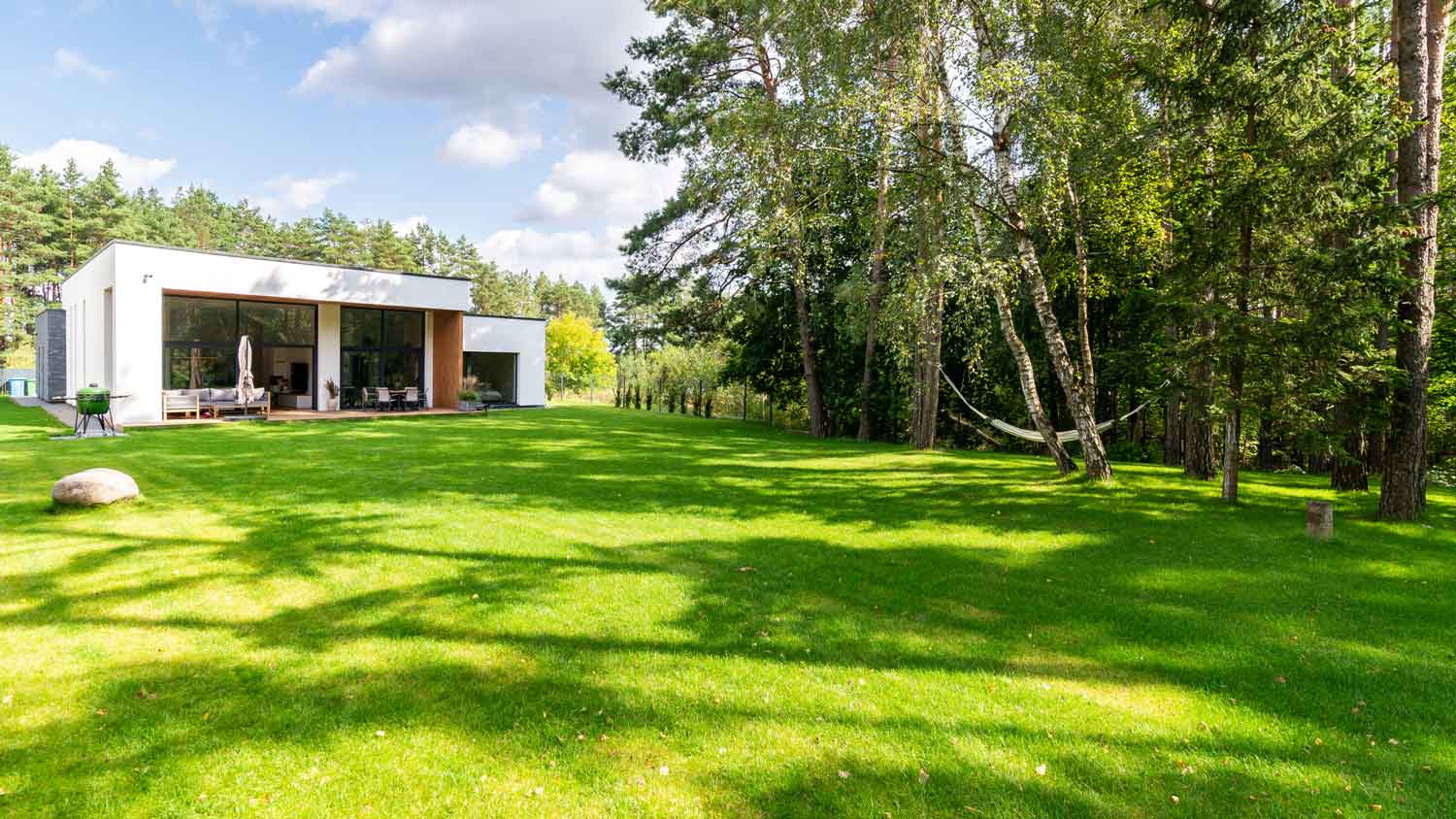 A house with a large green backyard