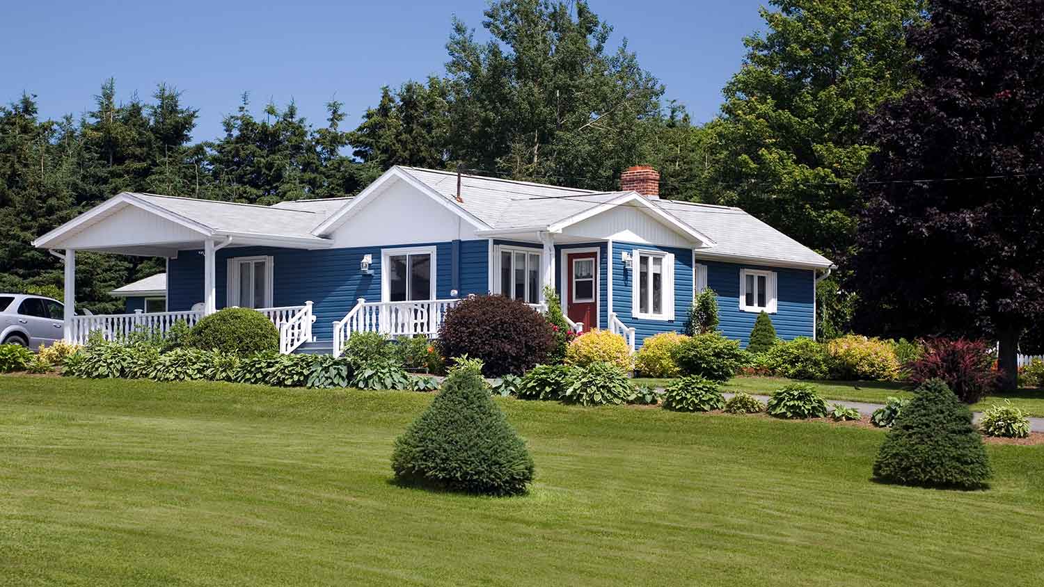 Blue house with porch in the country