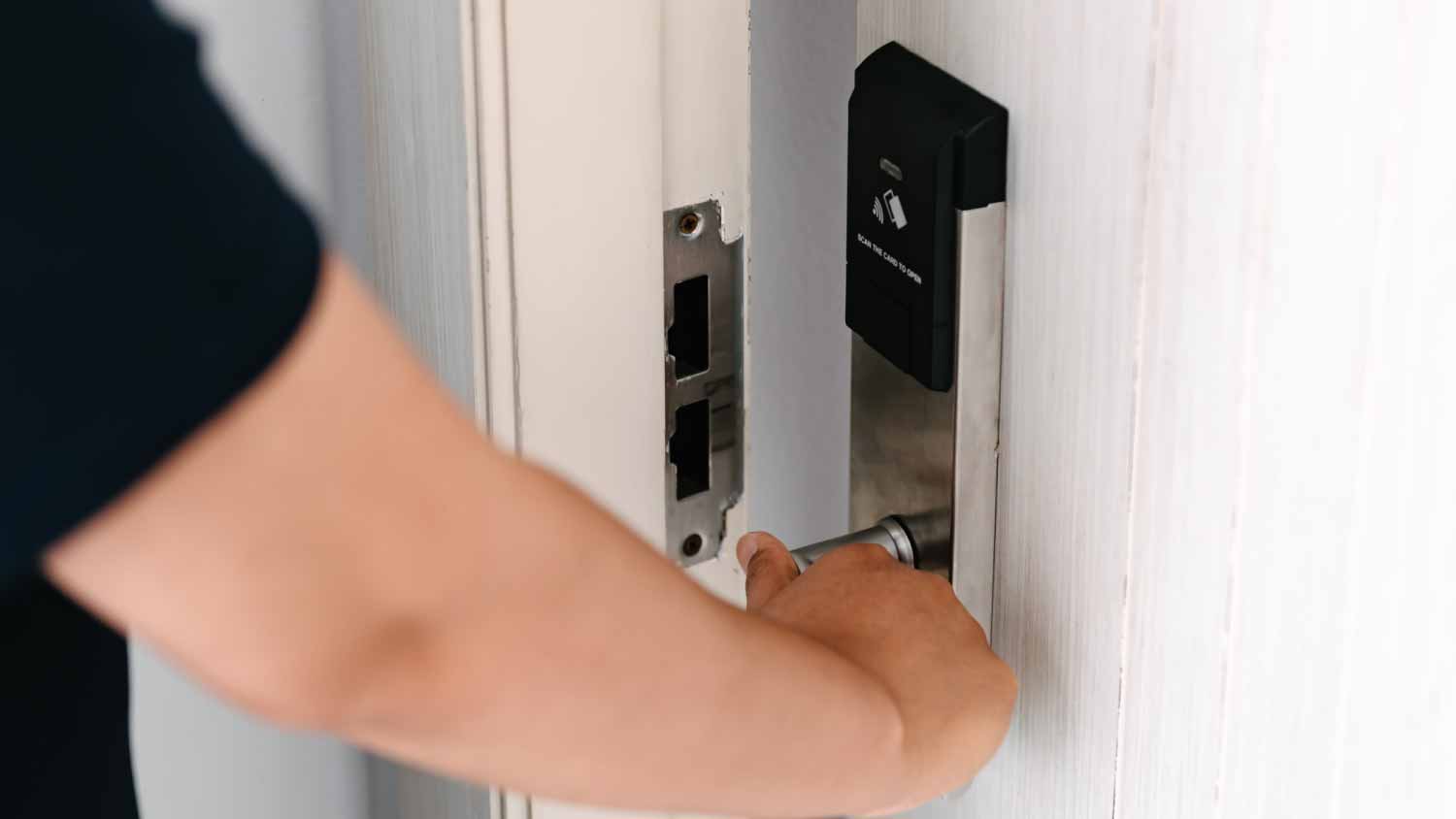 Woman opening a door in apartment