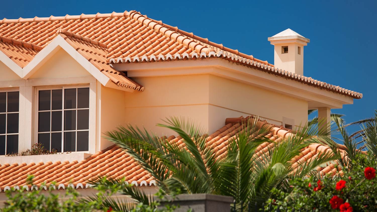A tiled roof of a large house