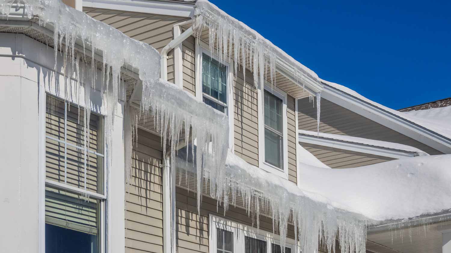 Ice dams and snow on roof and